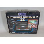 Boxed Sega Mega Drive II (untested) with Taz-Mania and Ecco the dolphin games