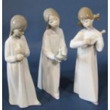 A large collection of Lladro figures to include three nuns, children in various poses, girl carrying