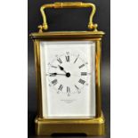 Victorian brass cased carriage clock, with enamelled dial and eight day time piece