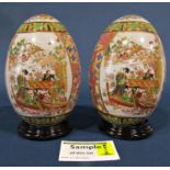 A collection of ceramics to include Imari dishes, pair of oviform vases with turned hard wood bases,