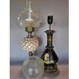 A black Greek design vase table lamp , an oil lamp with applied flower heads to the font, and a