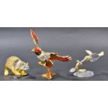 Three Swarovski cut crystal animals, a bear, a hummingbird, an eagle all with gilded embellishments,