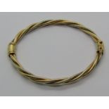 9ct bi-colour hinged bangle of rope twist design, maker 'B&N', 13.9g