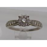 9ct white gold diamond halo cluster ring, centre stone 0.10ct approx, size J/K, 1.7g