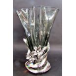 A large smoked glass handkerchief fold vase set in a silvered floral base, 40cm tall.