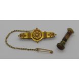 Etruscan style 15ct brooch, 3.2g and a miniature banded agate intaglio-cut seal (2)