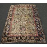 A Fine Turkish Silk Persian style carpet with a field of flowers and animals on an iridescent gold