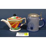 A collection of ceramics to include a teapot in the Clarice Cliff style, a stoneware stein with