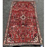 North West Persian Sarouk rug, with an all over stylised floral pattern on a madder red ground,188cm