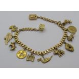 14k charm bracelet hung with thirteen novelty charms, mostly Eastern themed, to include a long boat,