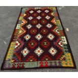 A Maimana Kilim with a repeating colourful over all geometric pattern, 258cm 153cm approx.