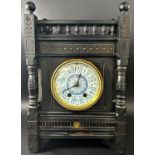 A Victorian mantle clock in the aesthetic style, the ebonised case with geometric detail and gilt