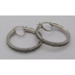 Pair of 9ct white gold hoop earrings channel set with cubic zirconia, 5g