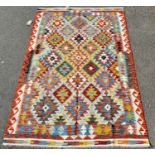 A Chobi Kilim with an all over repeating geometric pattern, 185cm x 125cm approx.