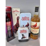 Two bottles of Famous Grouse Whisky, a bottle of Smoky Black Famous Grouse Whisky, and two