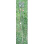 A pair of ornamental three stemmed heavy gauge steel border stakes, 180cm high