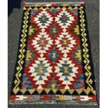 A Chobi Kilim with a brightly coloured all over geometric pattern, 131cm x 78cm approx