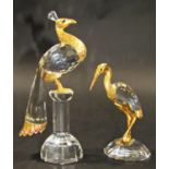 Two Swarovski cut crystal birds, a peacock and a heron both with gilded embellishments, 16cm and