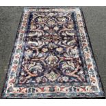 North West Persian Sarouk rug, with an all over foliate and bird pattern on a blue ground, 200cm x