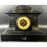 A Victorian black slate and marble mantle clock of architectural form enclosing an eight day