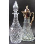A Warwickshire reproduction silver ornate Georgian style claret jug with a grapevine twisted handle,