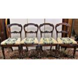 A set of four Regency rosewood dining chairs with carved and moulded frames, the splats with