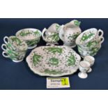 A Tuscan china green dragon collection of tea ware comprising graduated cups and saucers, two