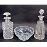 Eight various cut glass decanters, four varying glass bowls, a frosted glass candlestick, a glass