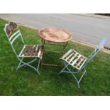 A painted steel three piece garden terrace or bistro set, with pierced and applied floral detail, (