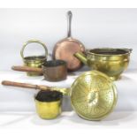 A collection of 19th century brass and copper pots and pans and a bed warmer.