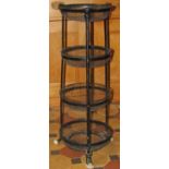 A painted cast alloy floorstanding vegetable stand, with four removable circular wire basket