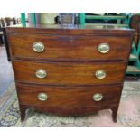 A Regency mahogany bowfronted chest of three long drawers with caddy top, raised on swept supports