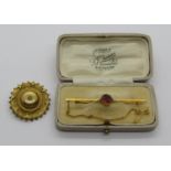 Edwardian yellow metal bar brooch set with garnet and seed pearls, 3.1g, together with a further