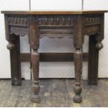 An old english oak credence or side table raised on turned forelegs with carved and repeating frieze