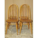 Set of four vintage stained elm and beechwood high hoop and stick back dining chairs with solid