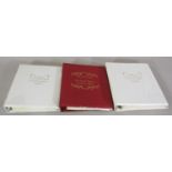three folders containing commemorative stamps f the wedding of HRH Prince of Wales and Lady Diana