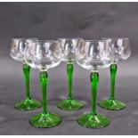 A mixed selection of glassware, including five green hock glasses, a Baccarat style paperweight an