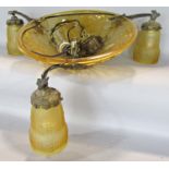 An Art Deco amber glass bowl ceiling light with three amber shaded down lights, complete with