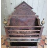 An antique Adams style cast iron and brass fire basket, with typical classical detail, together with