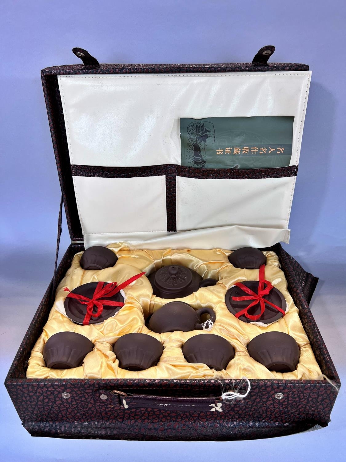 A Chinese clay tea service set in a briefcase, and a Chinese silk liners storage box. - Image 4 of 6