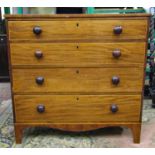 A small Georgian mahogany and pine chest of four long graduated drawers on swept supports with