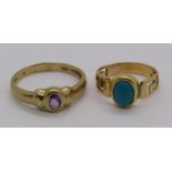 9ct amethyst ring, 1.9g and a further yellow metal turquoise ring with pierced Greek key detail, 2.
