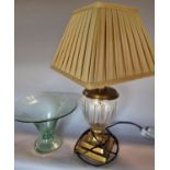 A cut glass vase shaped table lamp with a brass finish, and a cloudy blue glass fruit bowl.