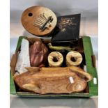 A novelty wooden pig trinket box, two Inuit carvings, a Kalimba thumb instrument, , a Japanese black