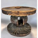 An African circular tribal hardwood Batonga stool, carved from one piece of wood 33.5 cm diam x 26.