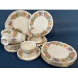 A collection of Paragon china tea wares comprising six tea cups, saucers and tea plates, cake