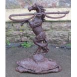 A reproduction cast iron umbrella stand in the form of a rearing horse with whip divisions and