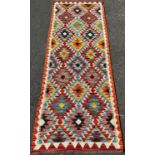 A Chobi Kilim Runner with a colourful repeating small diamond pattern,197cm 69cm approx.