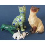 A collection of ceramic figures to include a Mosanic Galle style pottery cat, a further studio