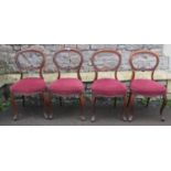 Set of four Victorian rosewood dining chairs with kidney shaped backs, over upholstered serpentine